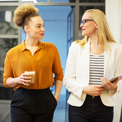 Businesswomen looking at each other in office